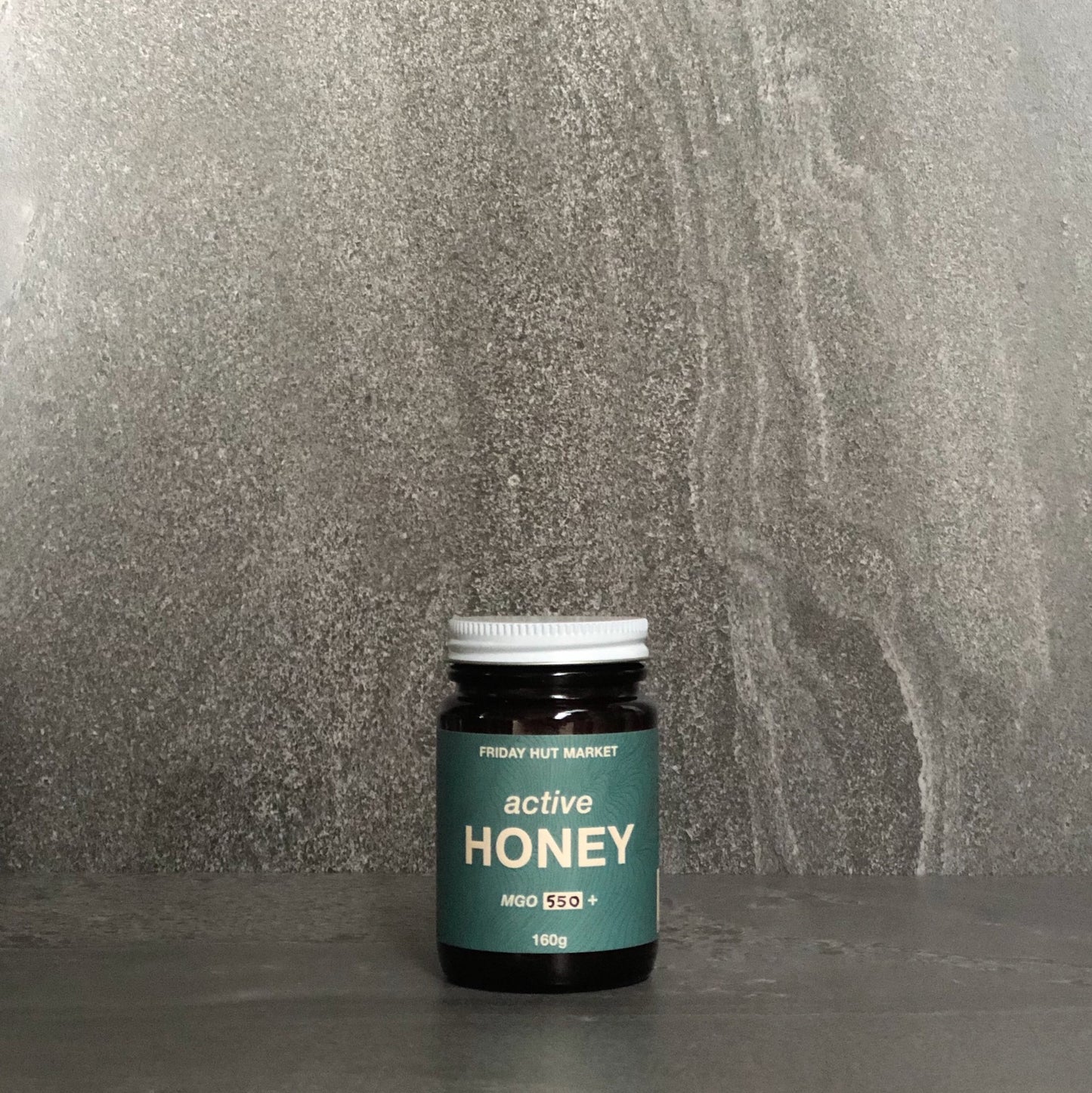 A jar of Friday Hut Market MGO 550+ Active Jellybush Honey. Australia's Manuka